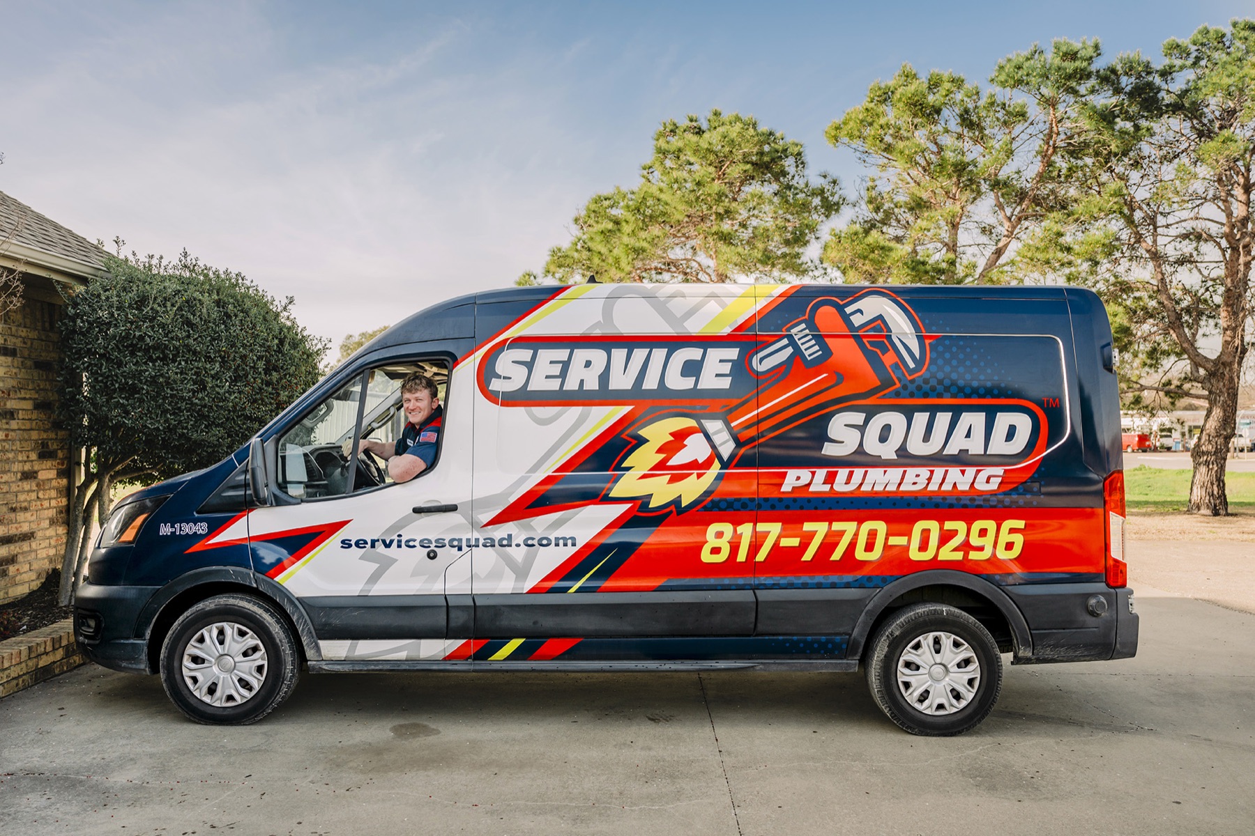 Service Squad plumbing van at a Fort Worth home